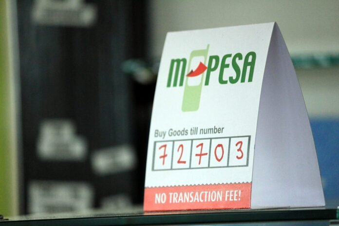 M-Pesa Buy Goods till number sign at a shop counter