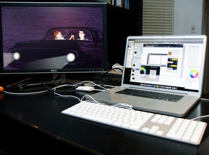 Work-from-home desk setup with a laptop and external monitor