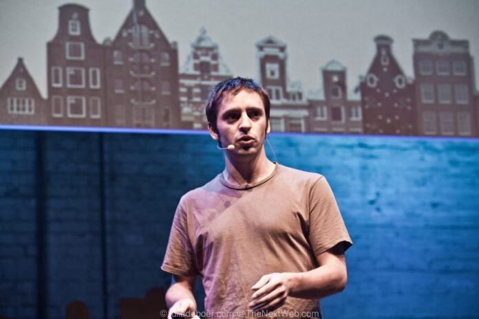 Founder pitching a startup on stage at a technology conference